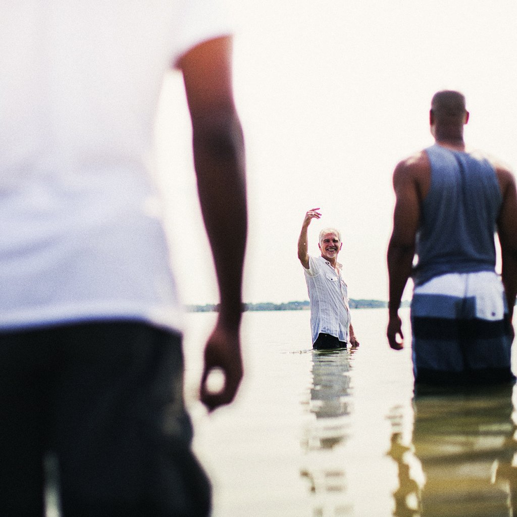 Men being baptized Rise Church Asheville Middle School River