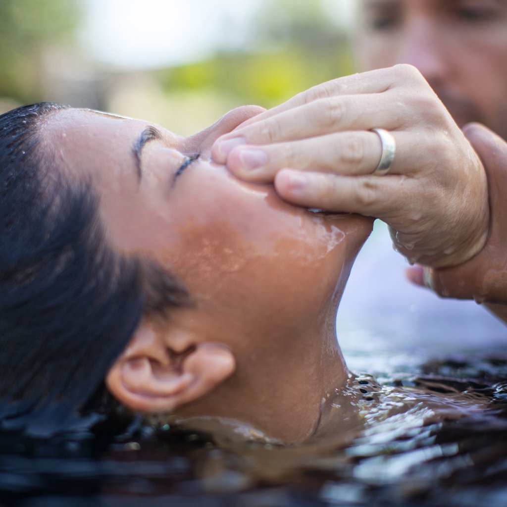 Young girl getting baptized Rise Church Asheville Middle School